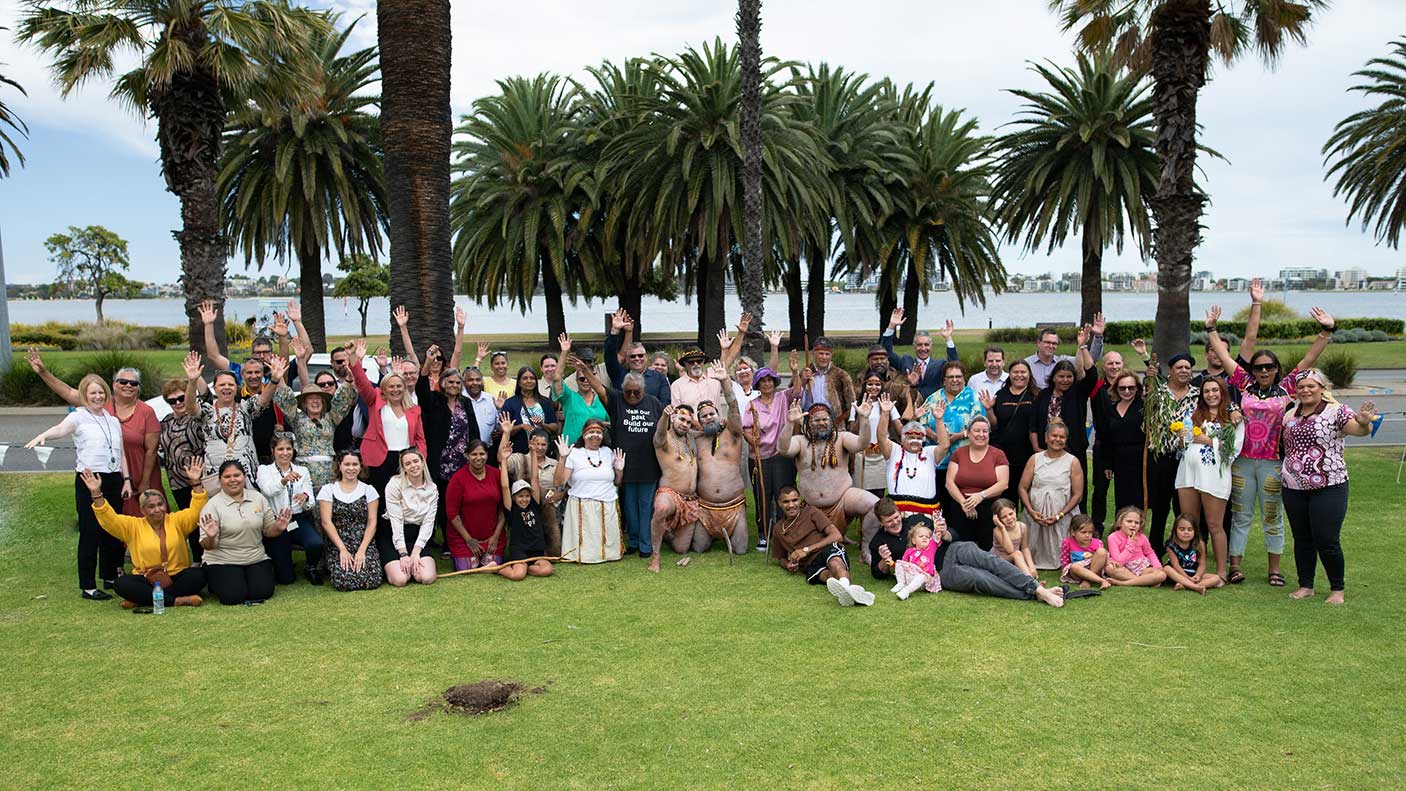 A large group of people together at the location of the new Aboriginal Cultural Centre