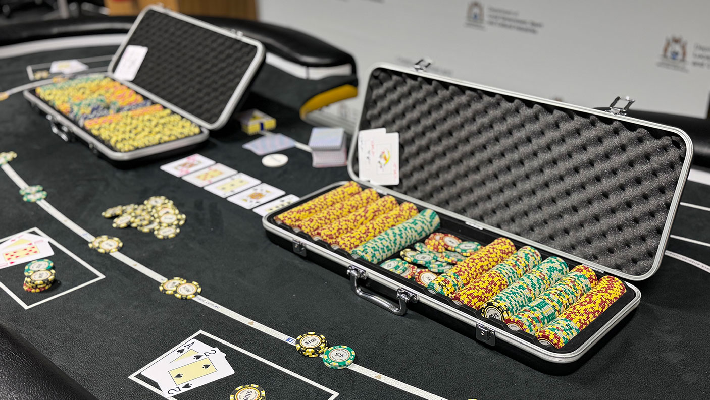 Gaming chips, card on a gaming table.