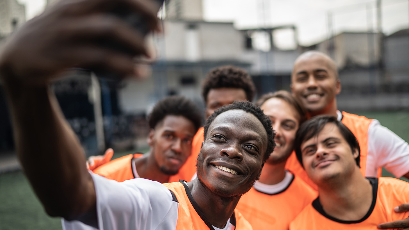 A sporting team pose for a selfie